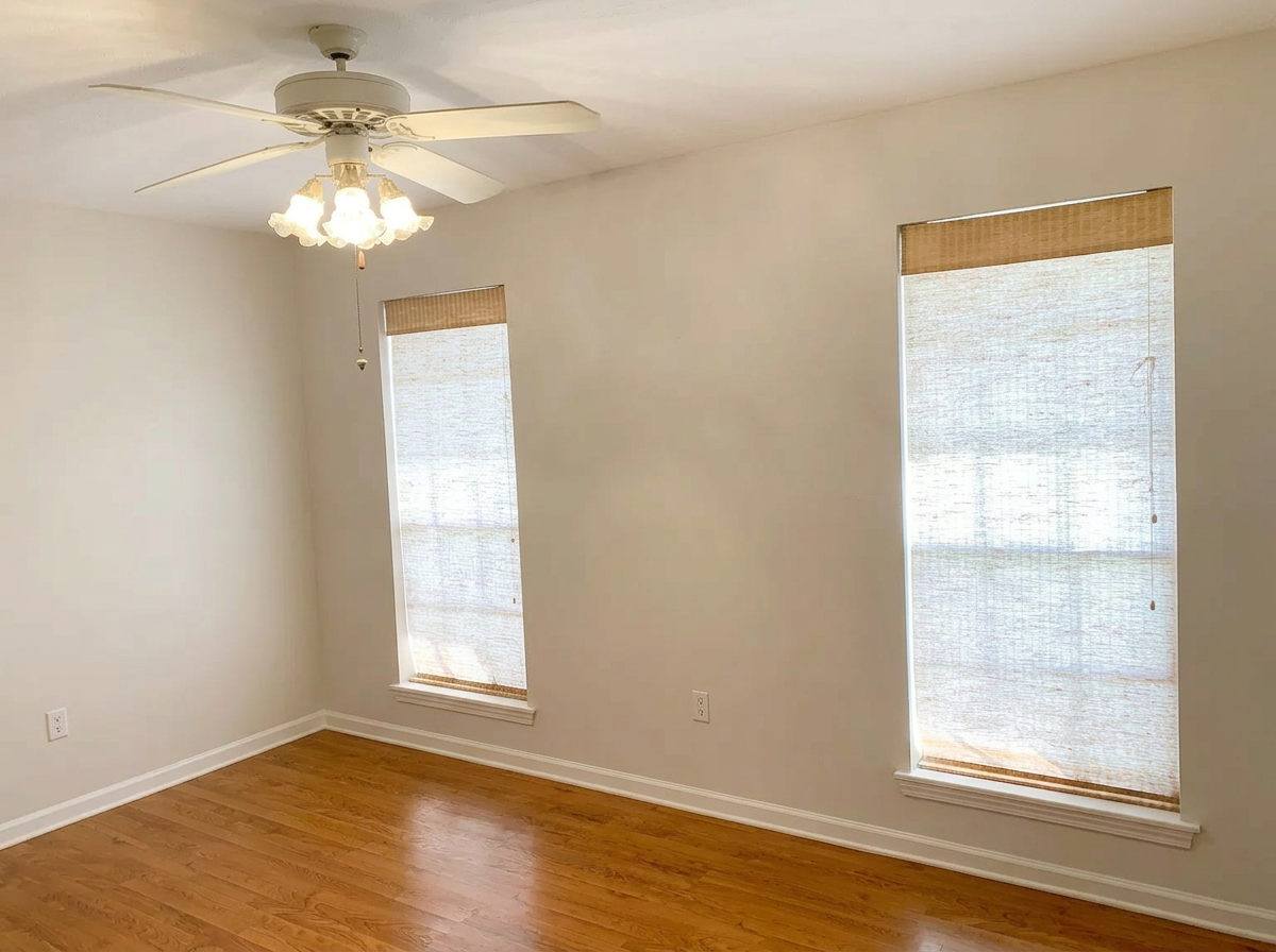 Bedroom with hardwood floors and ceiling fan